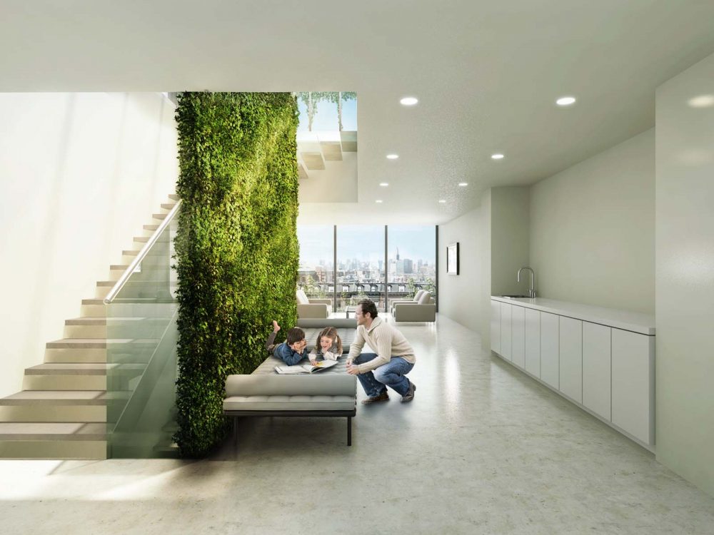 从大窗户透进来的自然光和垂直的植生墙带来的浓浓绿意充斥着整个内部空间。
